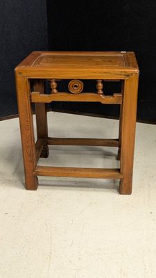 an image of a small wooden table with a drawer underneath it