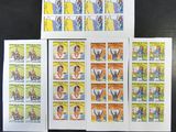 four different stamps with a picture of a man and a woman on them