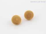 two yellow balls of yarn on a white surface with a white background
