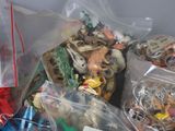 many different types of toys in plastic bags