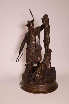 bronze statue of a man with a gun and a dog