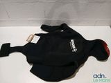 a black wet suit with a red patch on it