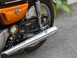 a close up of a motorcycle parked in a parking lot