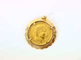 l'image d'une pièce d'or sur laquelle figure le visage d'une femme