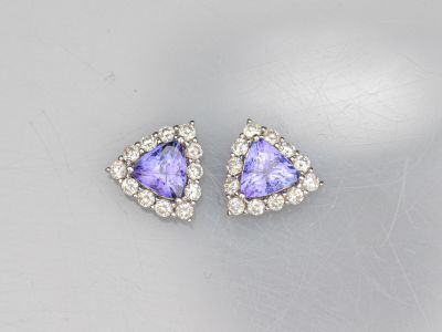 a pair of tanzanite and diamond earrings