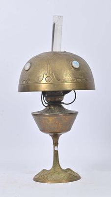a small brass object with a glass on top of it