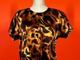 an image of a leopard print top on a mannequin mannequin mannequin mannequin mannequin mannequin mannequin manne
