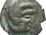 une pièce de monnaie ancienne sur laquelle figure un visage