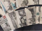 a lot of old postcards sitting on a table