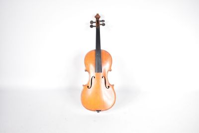 an orange violin sitting on top of a white surface next to a white wall