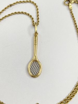 an image of a tennis racket and chain on a white surface