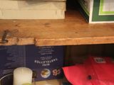 a wooden shelf with various items on top of it
