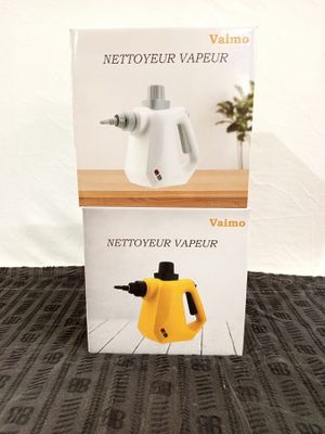 packaging of a yellow and white kettle sitting on top of a wooden table