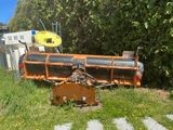 a large machine that is sitting in the grass