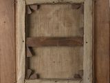an old picture of a wooden frame with a piece of wood sticking out of it