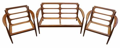three wooden chairs and a couch are sitting next to each other