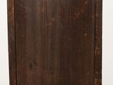 an old wooden cabinet sitting on top of a wooden floor