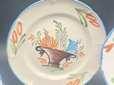 three plates that have different designs on them