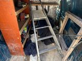 a ladder in the back of a van that is being worked on