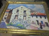 une photo d'un tableau représentant un bâtiment, dans un cadre doré