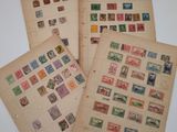 four different types of stamps on old paper on a table