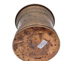 an old metal container with a label on it