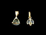 a pair of gold earrings with a blue topaz stone