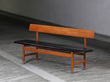 a wooden bench that is sitting in a room