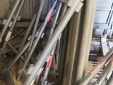 a pile of metal pipes and pipes in a room