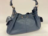 a blue leather handbag on a white background