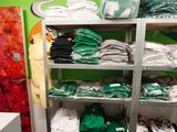 a room with a lot of clothes on the shelves