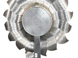 a large metal flower decoration on a white background