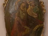 une image d'un tableau représentant une femme tenant un enfant dans ses bras