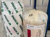 a bag of flour next to a bag of flour on the floor