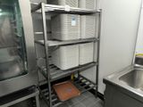 many rolls of toilet paper on the shelves in the kitchen