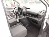 the interior of a car with the door open and the driver ' s seat down