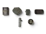 a lot of metal items that are on a white surface