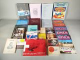 several books are stacked on top of each other on a table