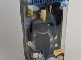 a close up of a toy figure in a box on a table