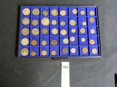 a picture of a blue tray with a lot of coins in it
