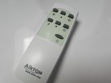 a remote control that is sitting on a white table