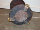 a picture of an old reel sitting on the floor