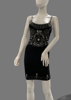 an image of a mannequin dressed in a black dress