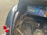 a car with a box in the trunk of it