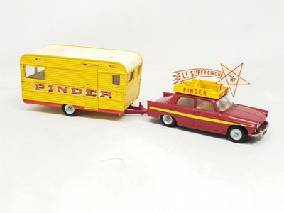 a toy car pulling a trailer with a trailer attached to it