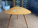 a wooden table with two legs and a wooden top
