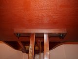 a wooden table with two legs and a wooden table top