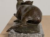 statue of a cat and a dog on a marble base