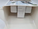 a white box with a magazine inside of it