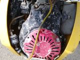 a close up view of a small engine on a motorcycle